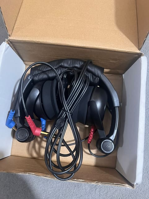 Audiometric headset unboxed with red and blue plugs and cable